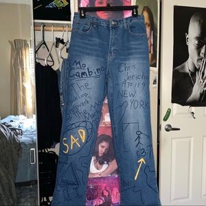 Blue denim jeans with graphic letters